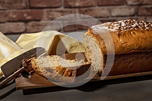 Freshly baked golden Banana Bread on a wood tray