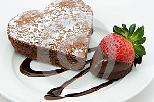 Freshly baked heart cake and strawberry