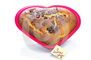 Freshly baked heart-shaped Valentines cake