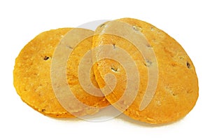 Freshly baked homemade biscuits with raisins isolated on white background