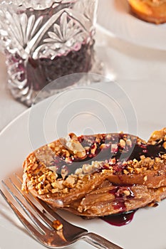 Freshly baked, homemade, peanut butter crunch, french toast, with blueberry sauce