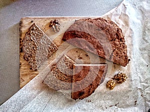 Freshly baked homemade rye bread on cutting board. Sliced. Top view.