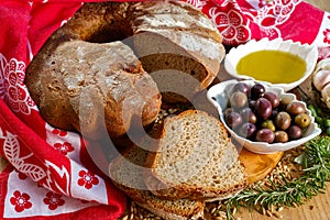 Freshly baked homemade sourdough spelt bread, extra virgin olive