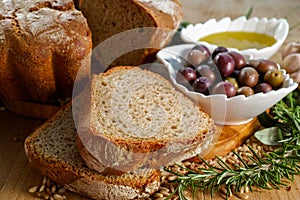 Freshly baked homemade sourdough spelt bread, extra virgin olive