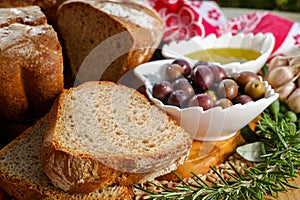 Freshly baked homemade sourdough spelt bread, extra virgin olive