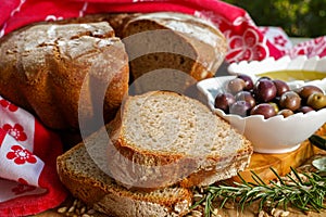 Freshly baked homemade sourdough spelt bread, extra virgin olive