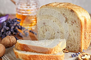 Freshly baked homemade wholegrain bread with walnuts, honey and lavender