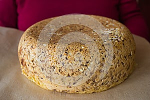 freshly baked loaf of bread with sunflower seeds