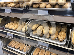 Freshly baked loaves of white bread on the shelves