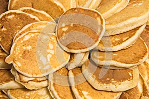 Freshly baked mini pancakes close up