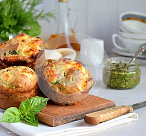 Freshly baked muffins with spinach, sweet potatoes and feta cheese on white background. Healthy food concept. Savory pastry