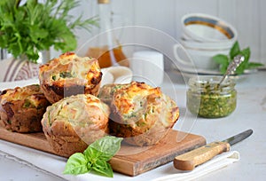 Freshly baked muffins with spinach, sweet potatoes and feta cheese on white background. Healthy food concept. Savory pastry