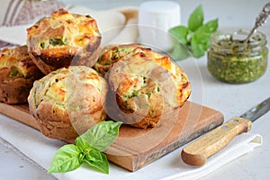 Freshly baked muffins with spinach, sweet potatoes and feta cheese on white background. Healthy food concept. Savory pastry