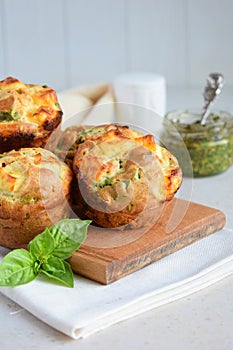 Freshly baked muffins with spinach, sweet potatoes and feta cheese on white background. Healthy food concept. Savory pastry