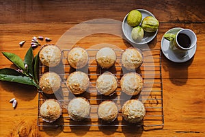 Freshly baked muffins on a  wooden kitchen bench