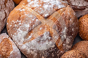 Freshly baked natural bread is on the kitchen table