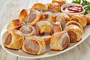 Freshly baked Puff pastry Sausage rolls, close-up