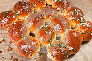 Freshly baked rolls smeared garlic butter and dill