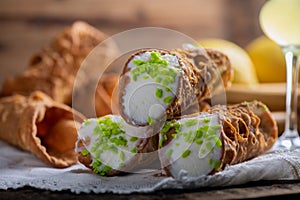 Freshly baked sicilian Cannoli dusted with powdered sugar