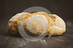 Freshly baked sliced bread on rustic wooden table. Close-up of t