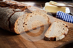Freshly baked sliced loaf of rye bread in closeup