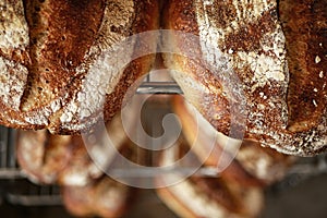 Freshly baked sour dough bread loafs left to cool down at the artesanal bakery. photo