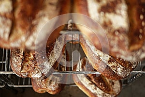 Freshly baked sour dough bread loafs left to cool down at the artesanal bakery. photo