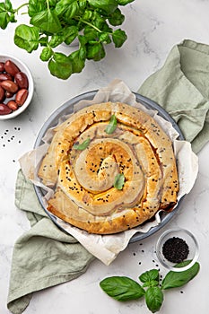 Freshly baked Spanakopita,  spiral filo pastry pie with feta cheese and spinach