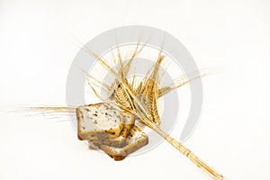 Freshly baked traditional bread with ears of wheat.