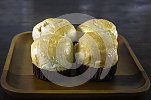 Freshly baked traditional bread on wooden table