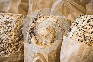 Freshly baked traditional loaves of wheat or rye bread in bakery