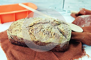 Freshly baked yeast-free homemade wheat-rye bread, on a linen napkin