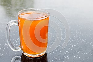 Freshly brewed black tea in glass mug, popularly known as Teh O in Malaysia photo