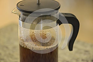 Freshly brewed coffee in french press coffee