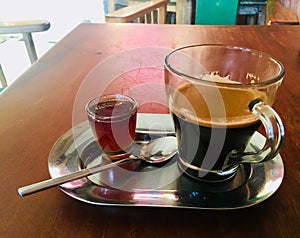 Freshly Brewed Coffee in a Glass Mug with Honey
