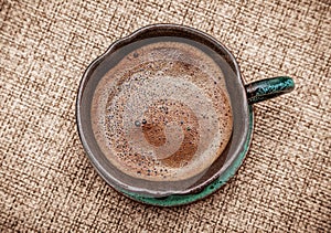 Freshly brewed coffee in a mug. View from above