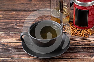 Freshly brewed hot winter tea on a wooden table
