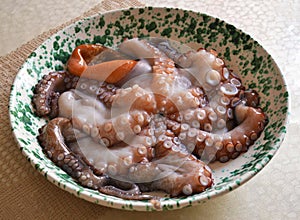 Freshly caught octopus in pot