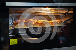 Freshly chiffon cake on baking trays in the oven. homemade bake,Selective focus