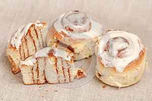 Freshly cinnabon French bun with cinnamon and cream, selective focus