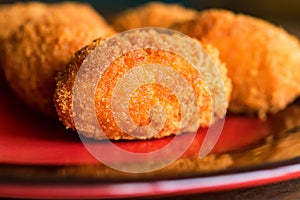 Freshly cooked breaded meat cutlets on plate