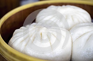 Freshly cooked Chinese Baozi or buns in bamboo steamers