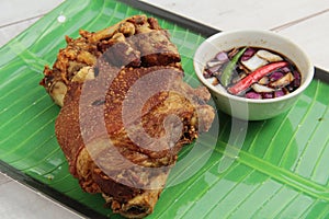 Freshly cooked Filipino food called Crispy Pata or deep fried crispy pork leg