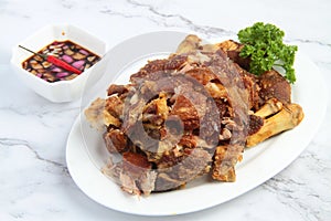 Freshly cooked Filipino food called Crispy Pata or deep fried crispy pork leg