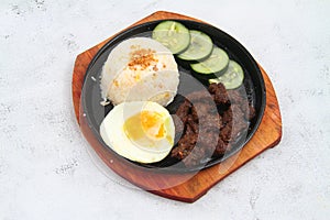 Freshly cooked Filipino meal called Tapsilog photo