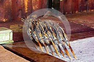Freshly cooked Iwana (grilled Char) at a traditional Japanese mountain hut photo