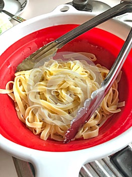 Freshly Cooked noodles in strainer