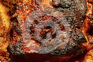 Freshly cooked pork well-done with a textured crispy dark brown crust