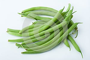 Freshly cut green beans photographed on white background