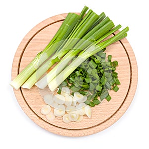 Freshly cut green onion on cutting board